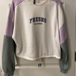 Multi colored, patch sleeve cropped crewneck